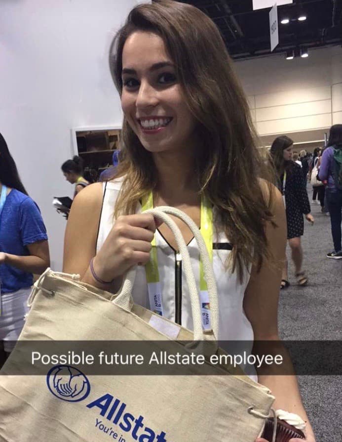 Emily at the Grace Hopper Conference with an Allstate bag